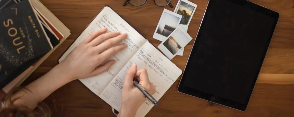 woman writing in a notebook