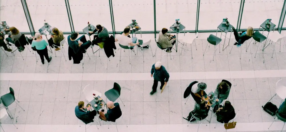 groups of people sitting at tables