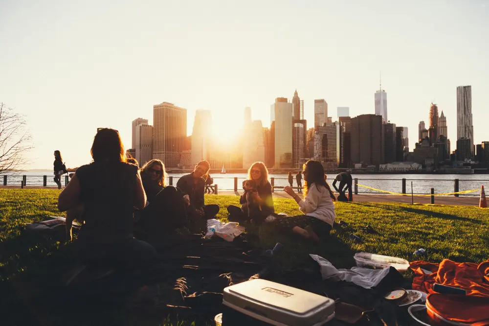 young people relaxing by a river