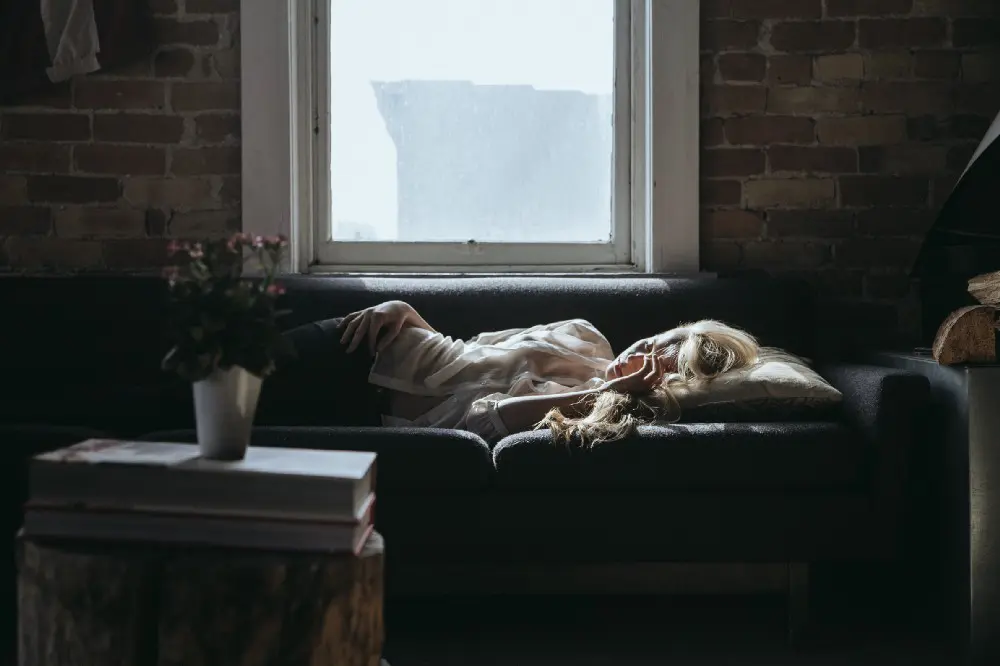 woman napping on a couch