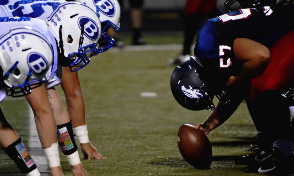 Football players representing Agile vs Waterfall idea