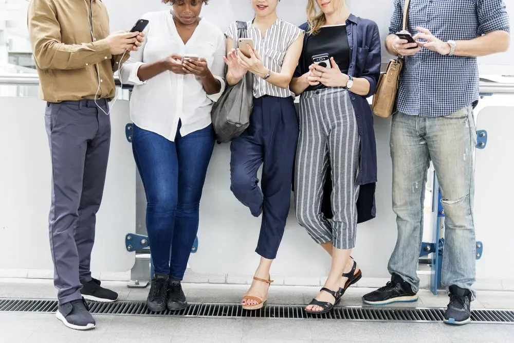 Group of people using their phones