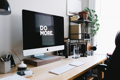 productivity quote screensaver on desk in room